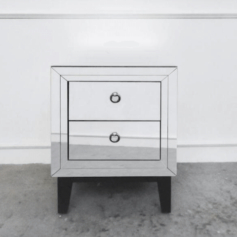 Two drawer mirrored side table with handles and black legs.