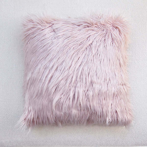 This gorgeous pink fluffy faux fur cushion is the perfect colour to soften the look of a dark living room. 