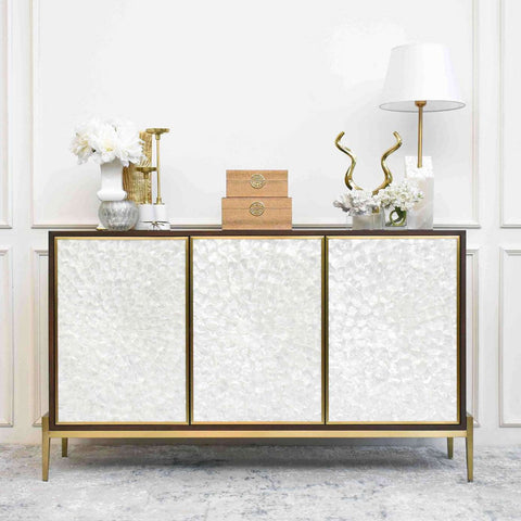 Harbour Sideboard sits in modern luxury living room decorated with entryway decor, and is beautifully juxtaposed by the metallic champagne gold details for a timeless design.