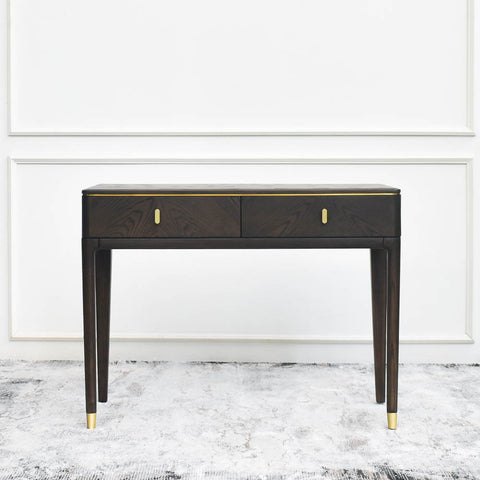 Image of the Odette Console Vanity Table: A sleek, modern vanity table showcasing its timeless wood surfaces and straight-lined cabinets, highlighting its versatile design and gold details 
for any home.