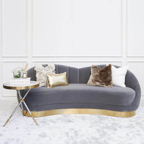 Create a cosy and intimate feeling with the Primrose 3 seater Curved sofa, style the set with hues of brown and beige cushions and the Cristian marble side table.