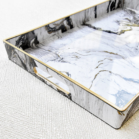 White marble tray with handle at the side for easy carrying and serving.