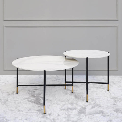 Rococo Round Nesting Coffee Tables Round Marble Small and Large, powder coated black legs and gold tip.