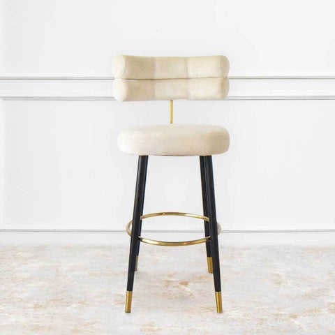 Solange Modern Art Deco Bar Stool with a sleek upholstered seat, curved backrest, and sturdy metal legs—combining comfort and elegance for a stylish kitchen or bar area.